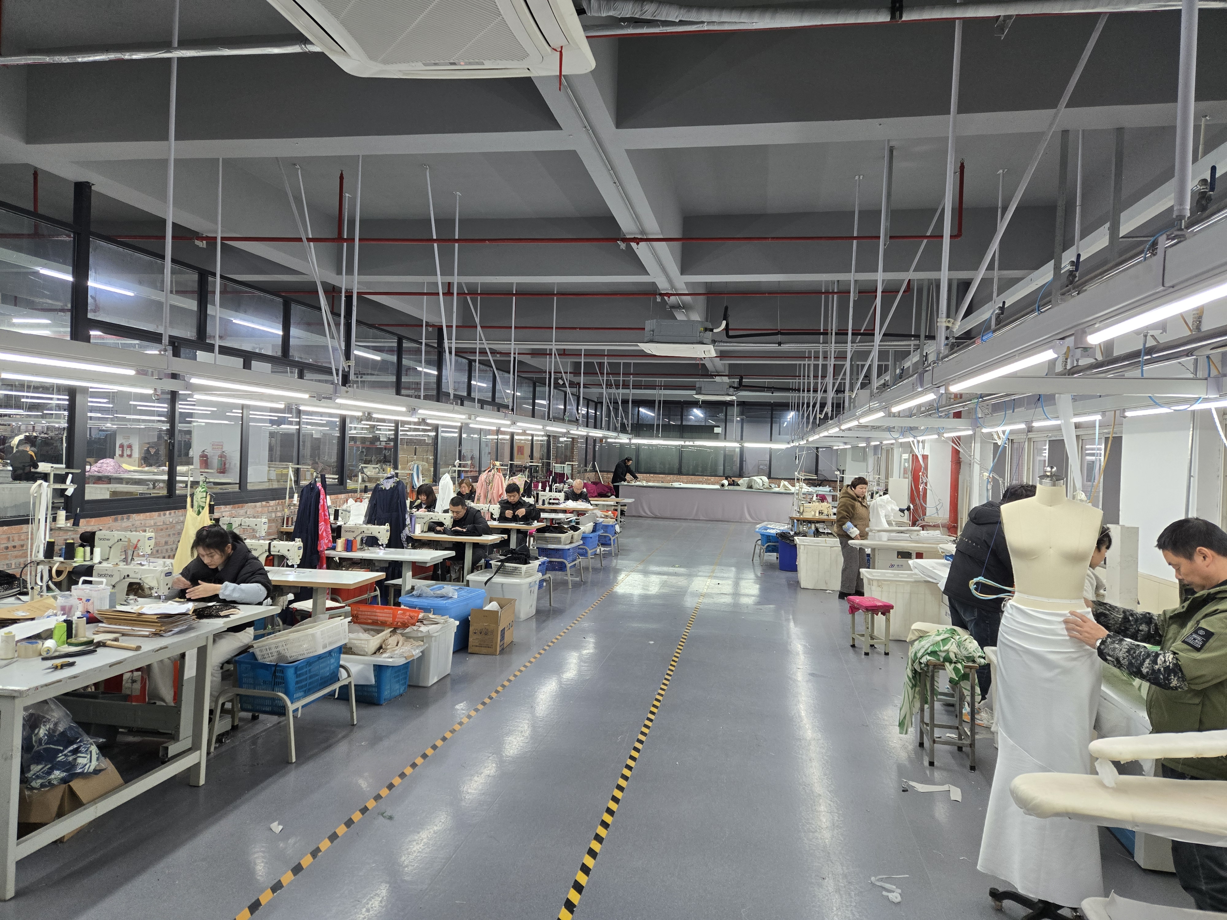 Sample room with pattern makers developing womenswear prototypes