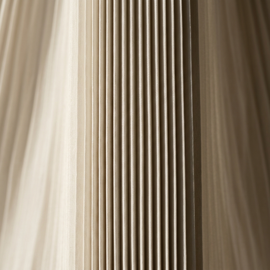 Precision pleating on evening dress — knife pleats heat-pressed and built to hold shape