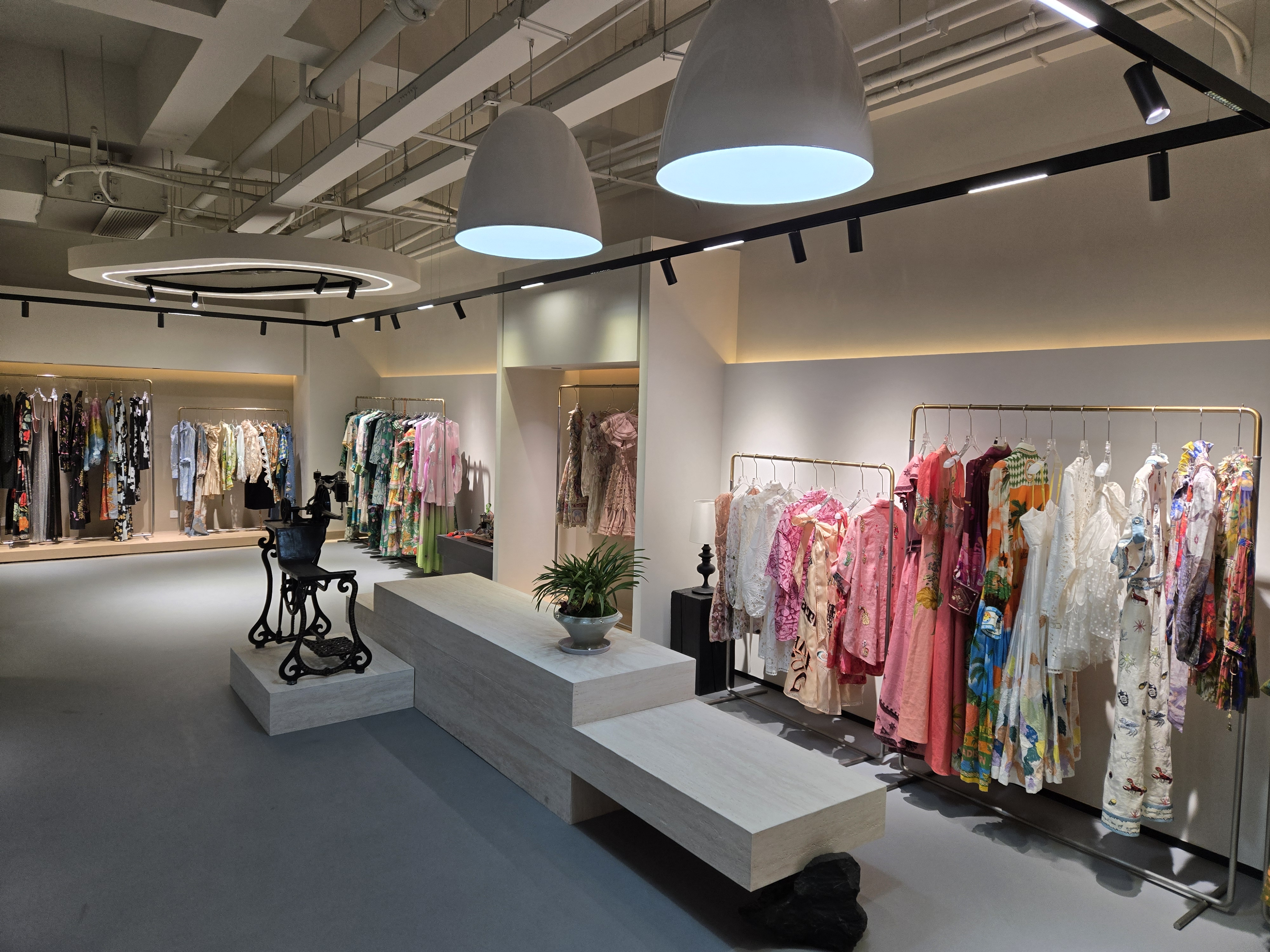 Showroom with garment racks holding foundation silhouettes from the Ready Styles catalog